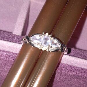 Silver ring with blue topaz stones